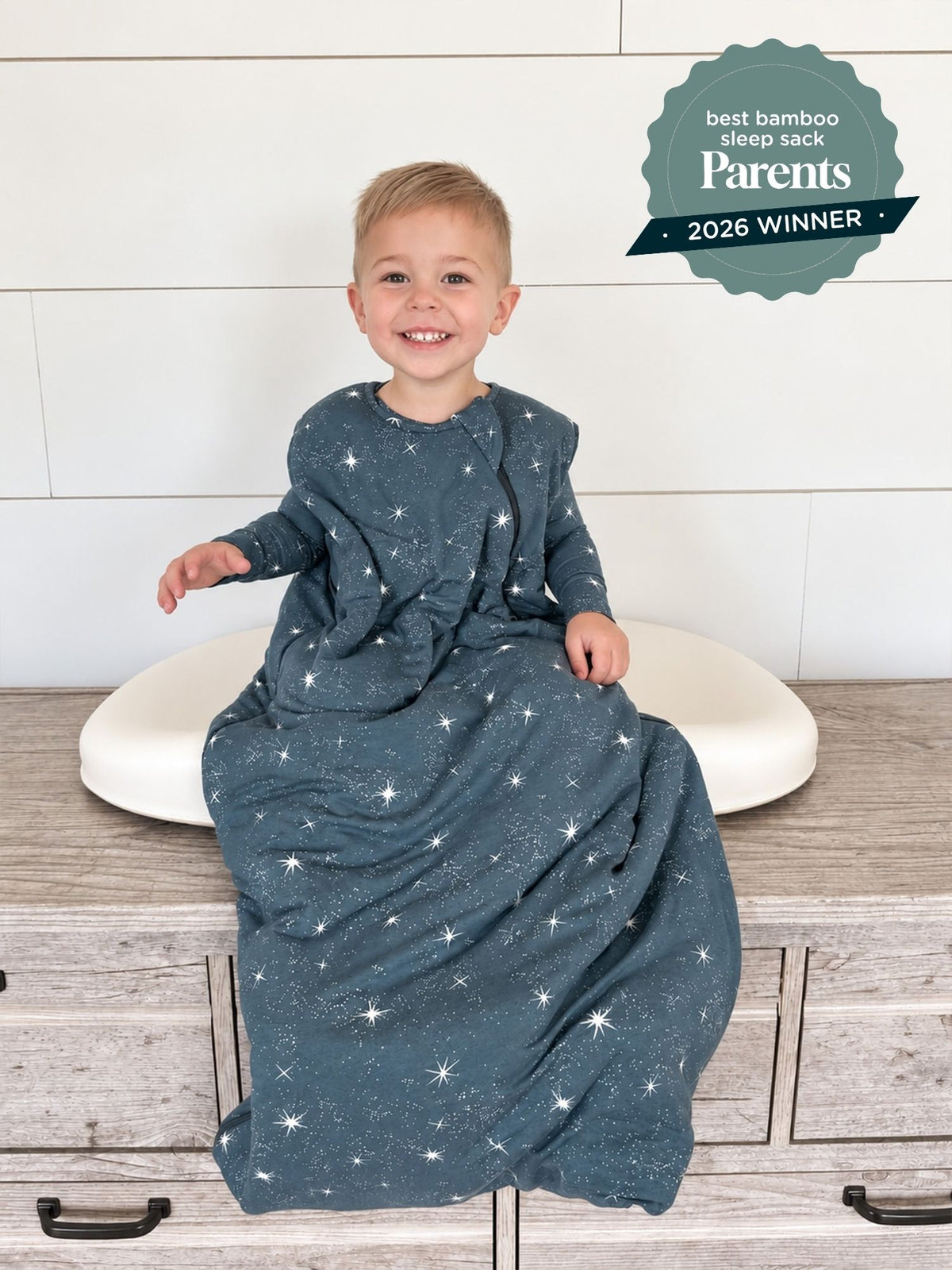 Dark blue star-print sleep sack with long sleeves and arm openings