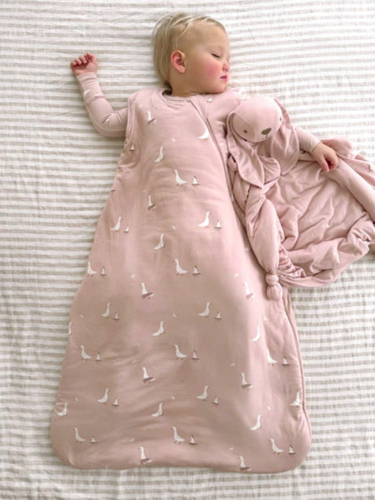 Pink sleep sack with swan print and zipper front