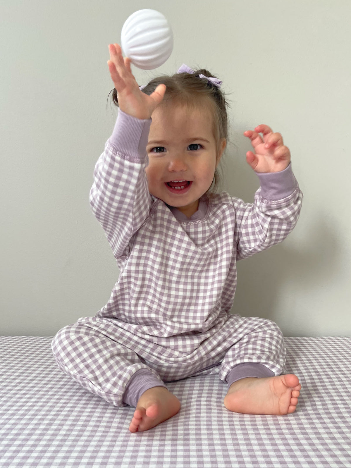 Lavender gingham fleece footed jumpsuit with long sleeves, snap legs
