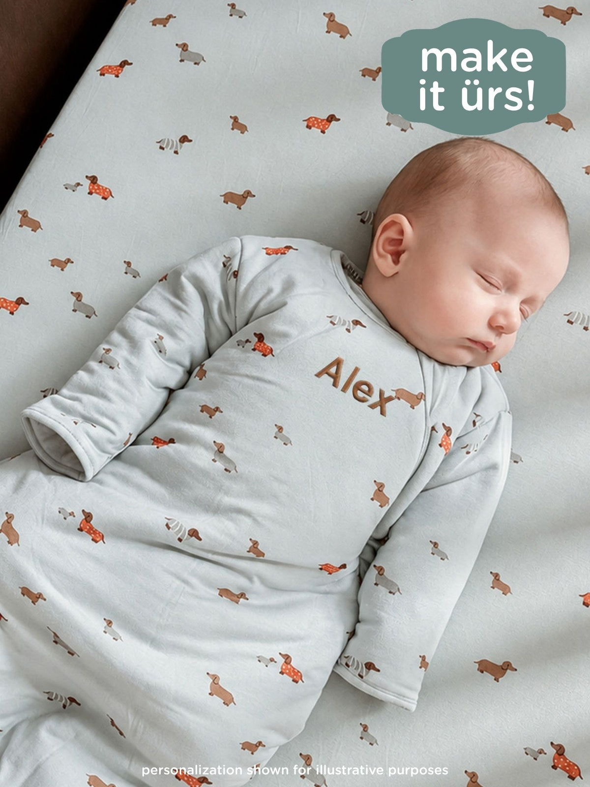 Personalized light blue long-sleeve sleep sack with orange dog prints, name Alex.