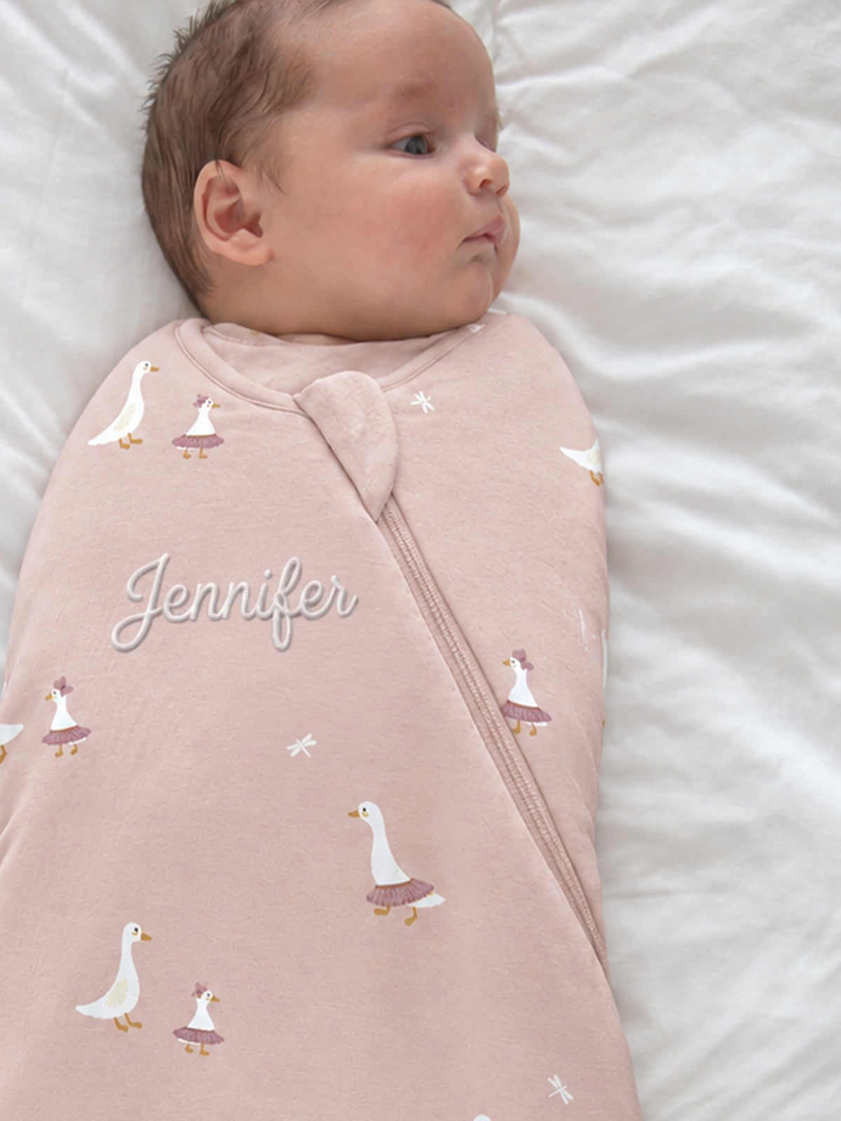 Pink goose-print swaddle sleep sack with 'Jennifer' and front zipper