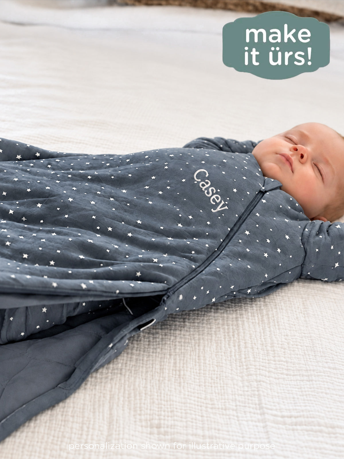 Long-sleeve star-print sleep sack with front zipper and personalized name embroidery.