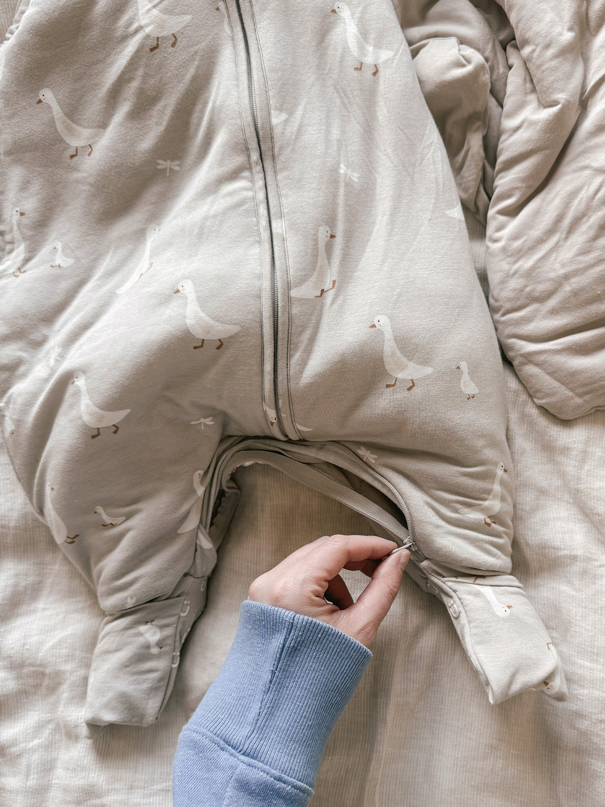Goose-print sleep sack detail: zip front and elastic foot openings, 1.0 TOG