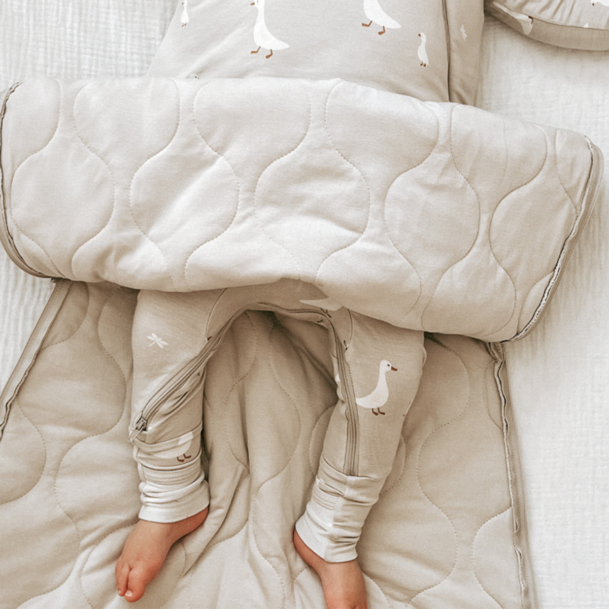 Quilted long sleeve sleep sack with goose print, zip front, and open leg area