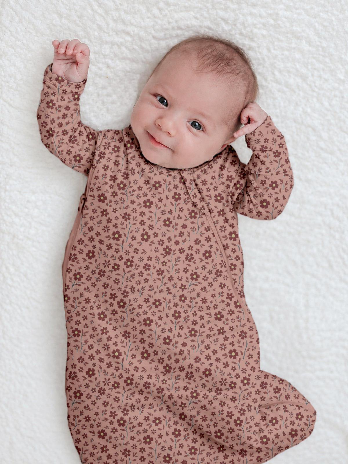Pink floral infant sleep sack with long sleeves and open arm openings