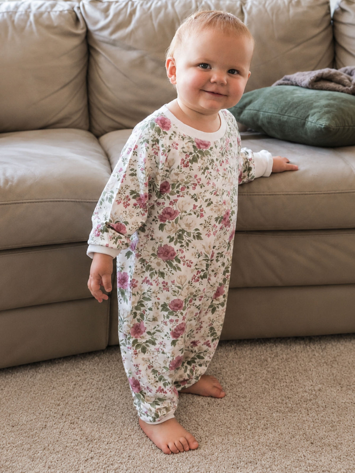 Baby fleece floral jumpsuit with long sleeves and pant legs, full-body fit