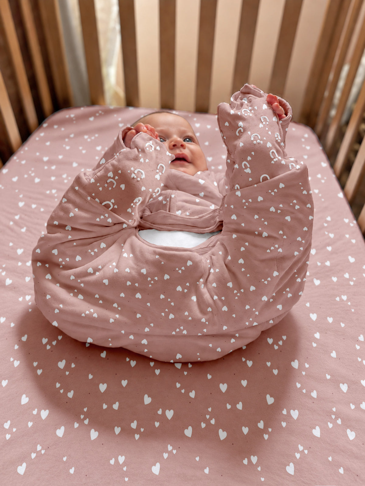 Pink heart-print footed sleep sack with mitten-like cuffs and enclosed feet, 2.5 TOG