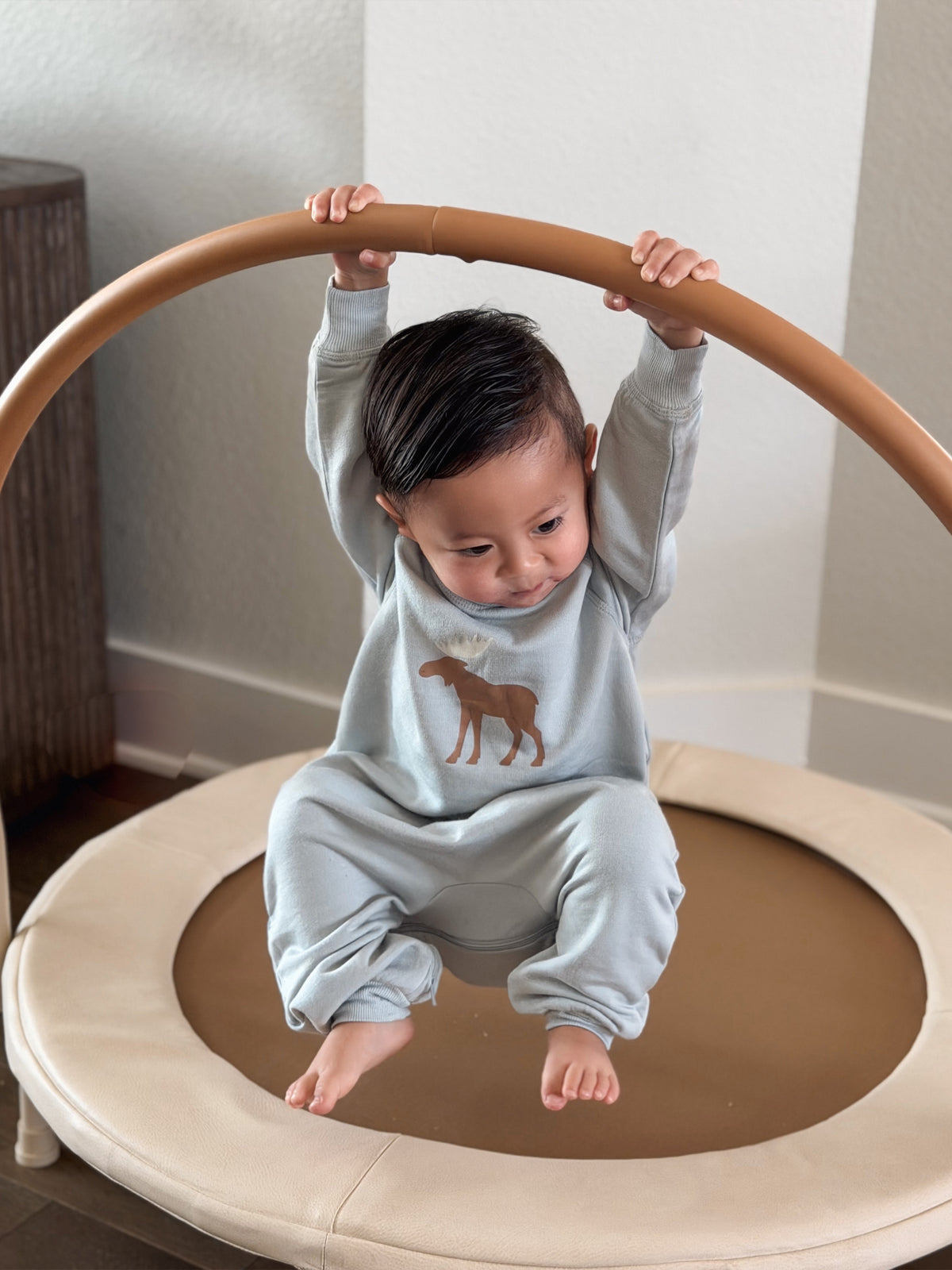 Light gray fleece jumpsuit with moose graphic, long sleeves and cuffs