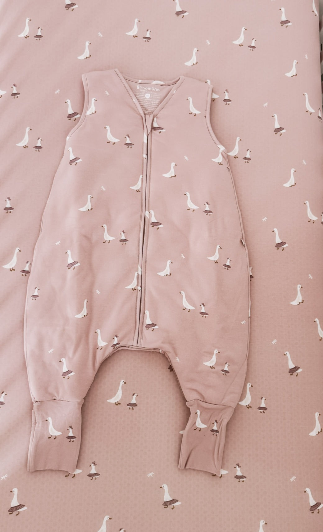 Pink duck-print footie sleep sack with full-length zipper and foot openings