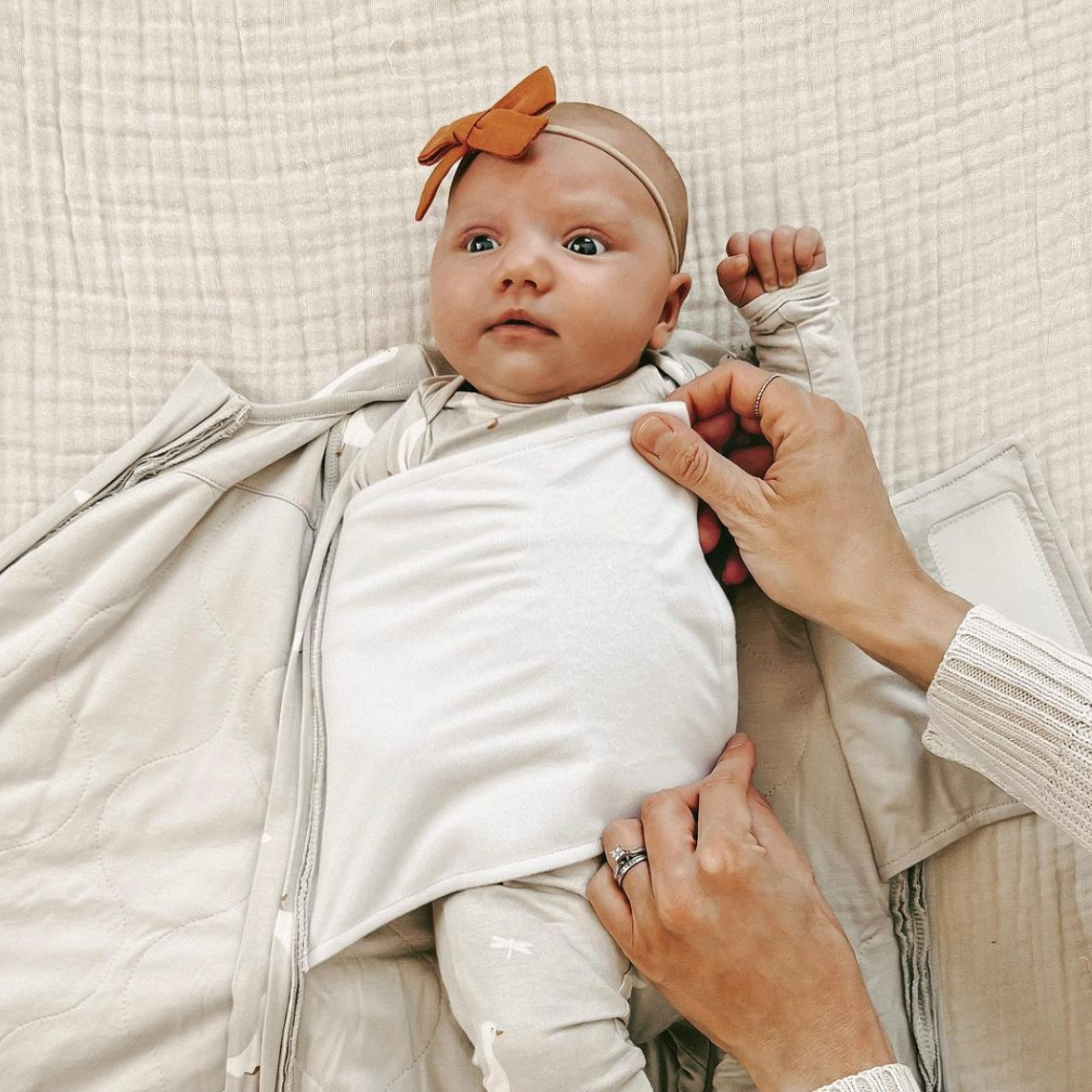 Baby gets hands out of swaddle hotsell