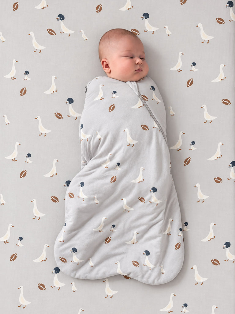 Swaddle sleep sack with football print, 2.5 TOG, light gray wrap around baby