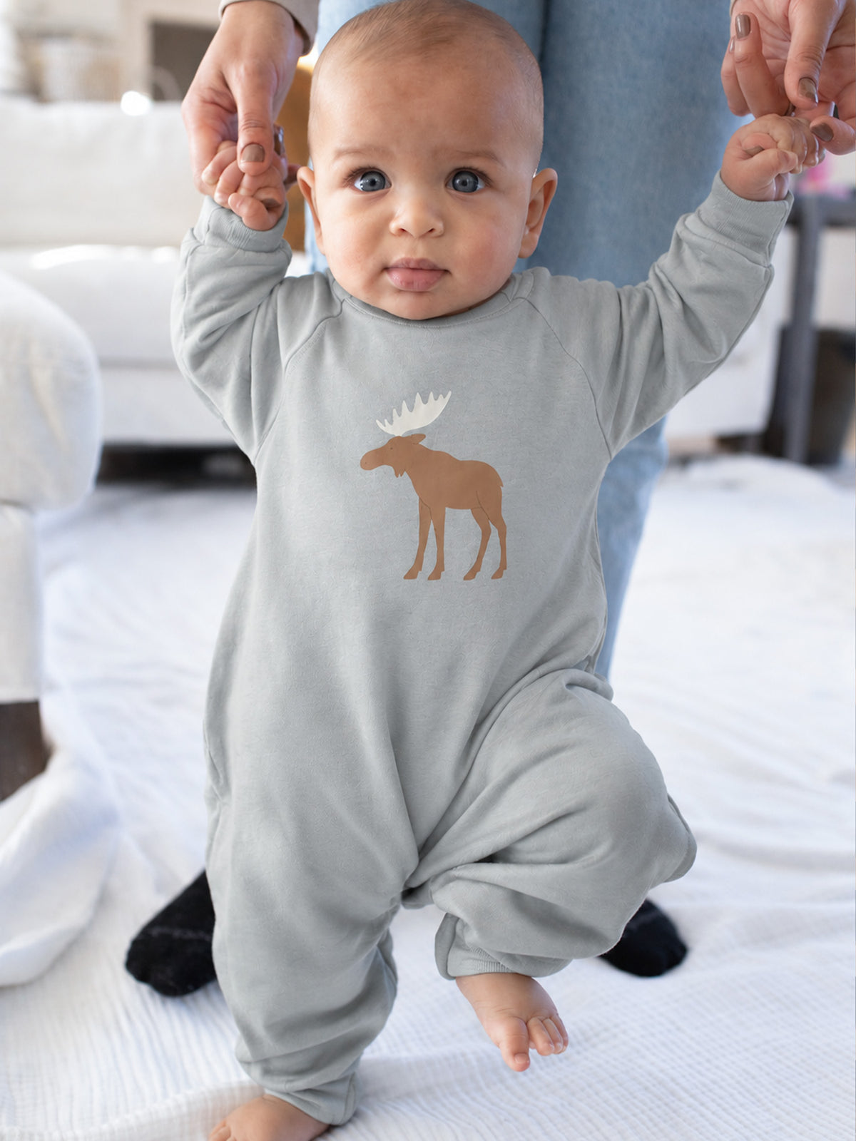 Light gray fleece jumpsuit with moose graphic, long sleeves, snap legs