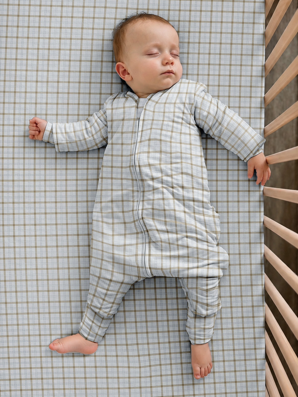 Long sleeve plaid footie sleep sack with front zipper, worn by a baby, 2.5 TOG