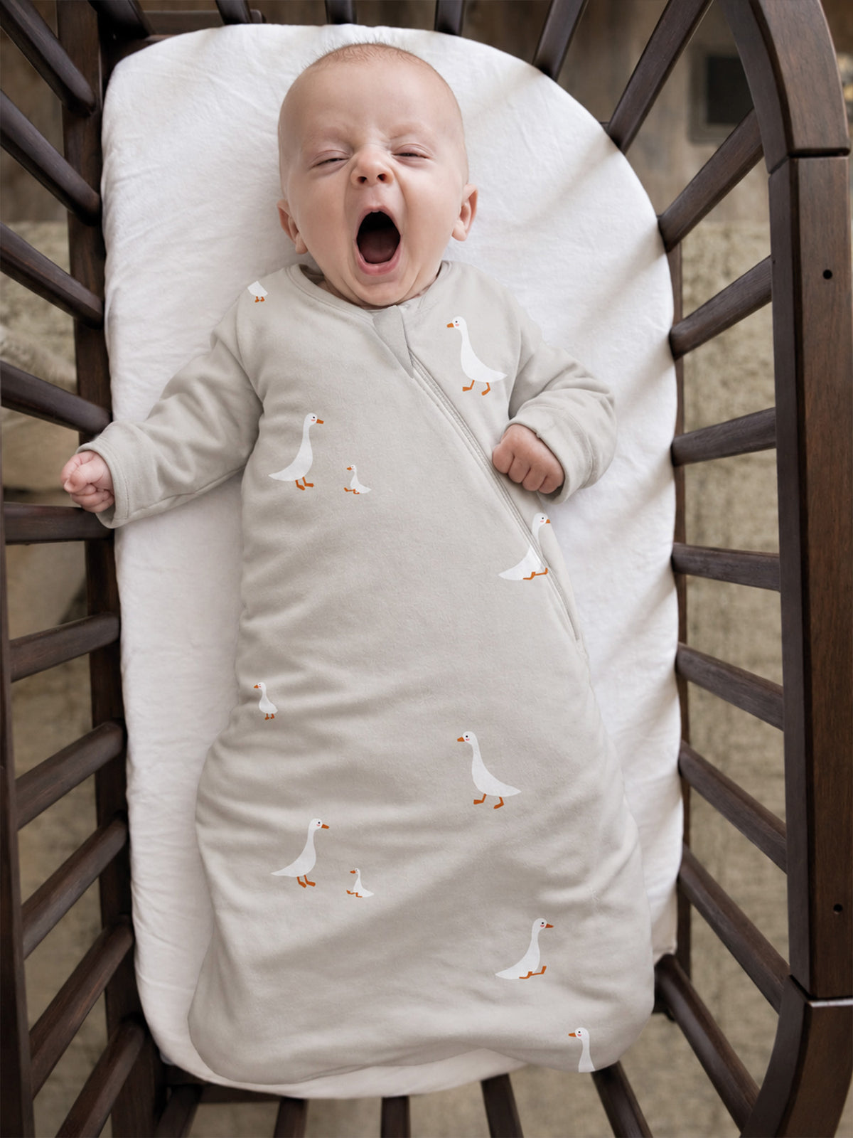 1.0 TOG long-sleeve swaddle sleep sack in cream with goose print, zip-front
