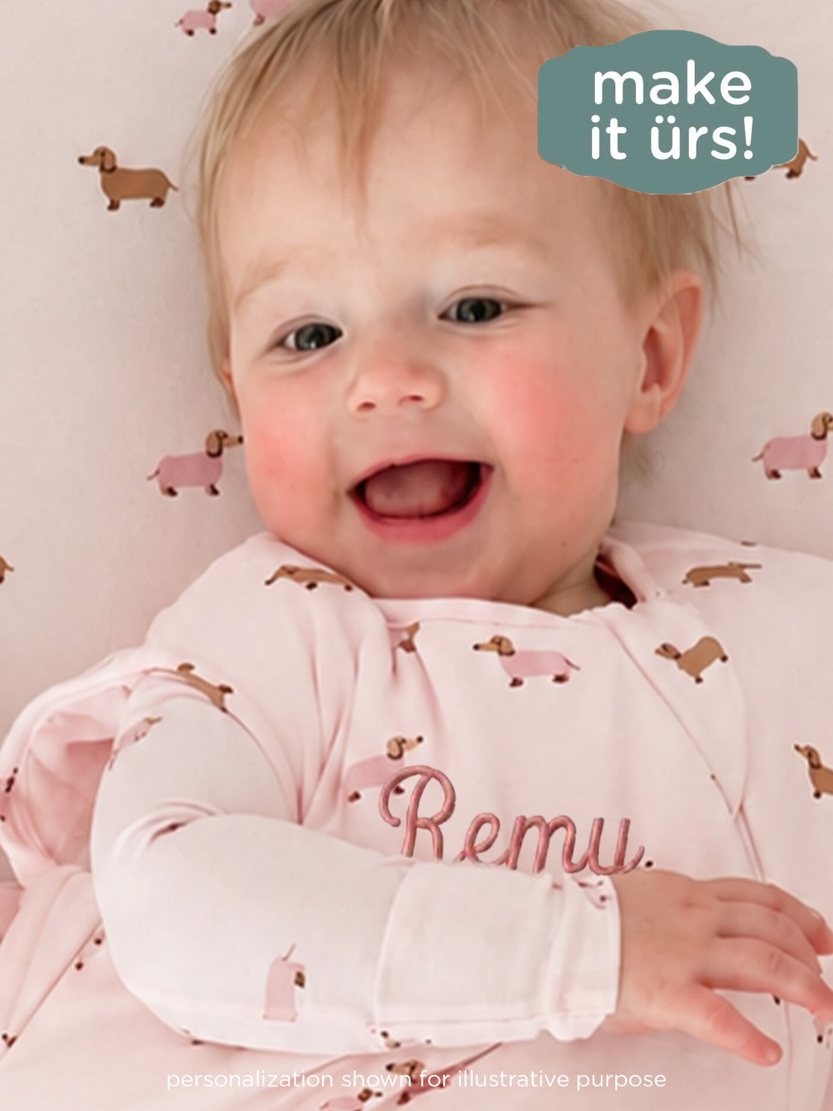 Pink dog-print sleep sack detail with personalized name on chest, long sleeves