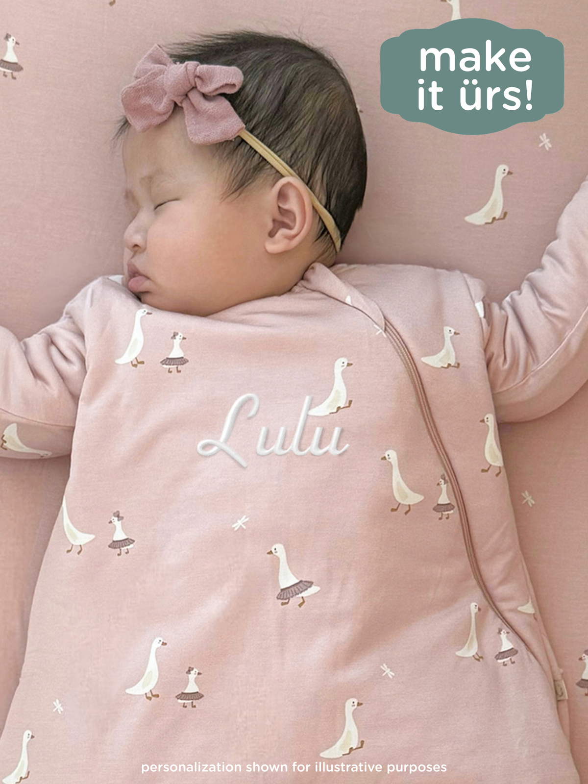 Blush pink long-sleeve sleep sack with white swan print and side zipper