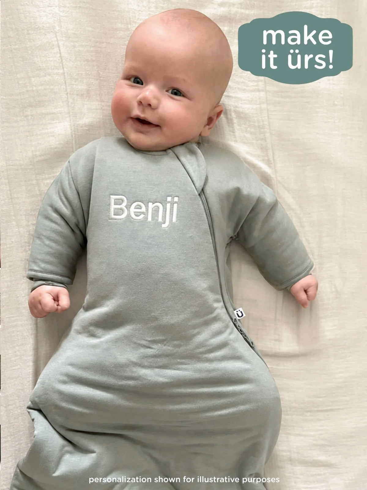Sage green swaddle sack with 'Benji' name embroidery and front zip