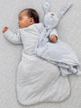 Long-sleeve swaddle sack in light blue with small floral print and bunny hood