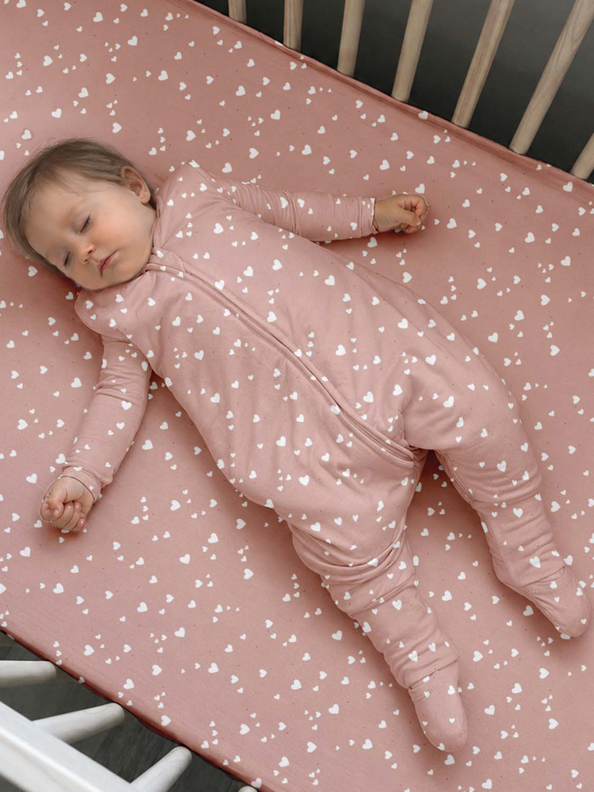 Pink heart-print footed sleep sack with long sleeves and enclosed feet, 2.5 TOG