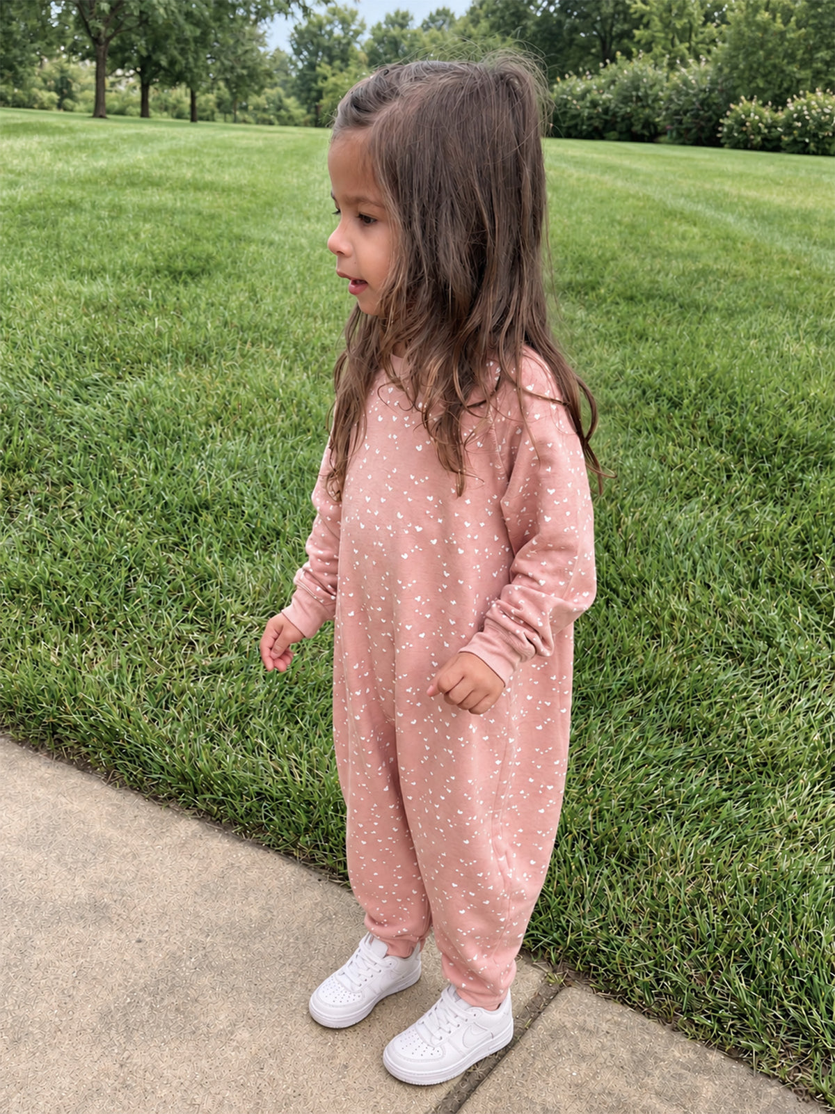 Pink fleece heart-print toddler jumpsuit with long sleeves and full legs