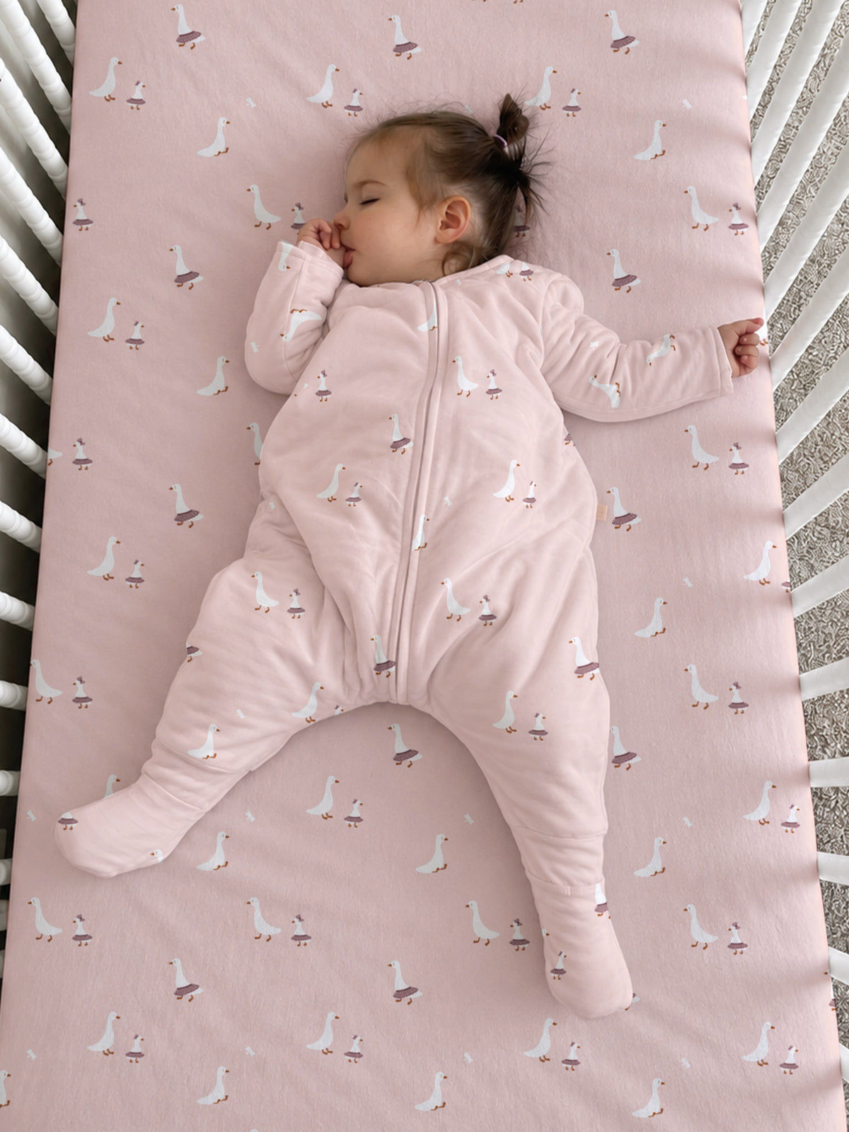 Light pink footed sleep sack with goose print and full front zipper