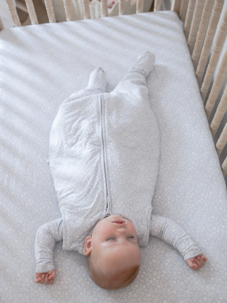 Light blue patterned footie sleep sack with full-length zipper and covered feet