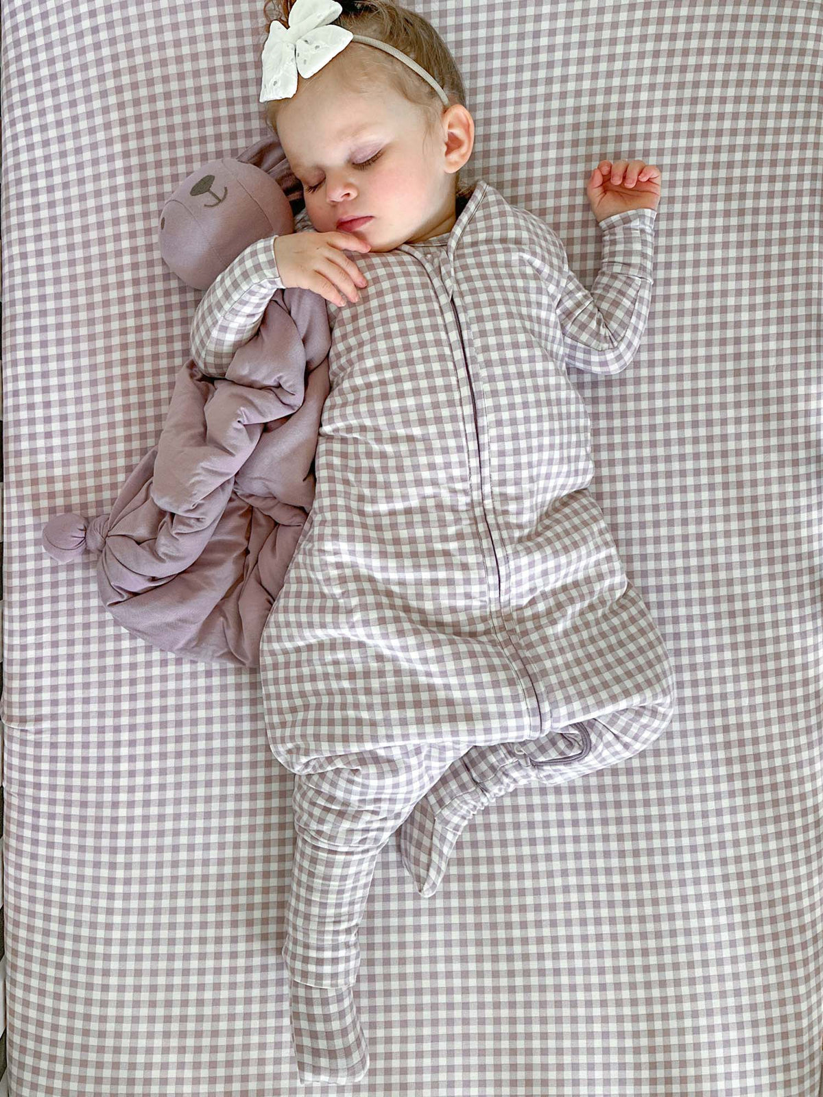 Gingham footed baby sleep sack with front zipper and small bear applique