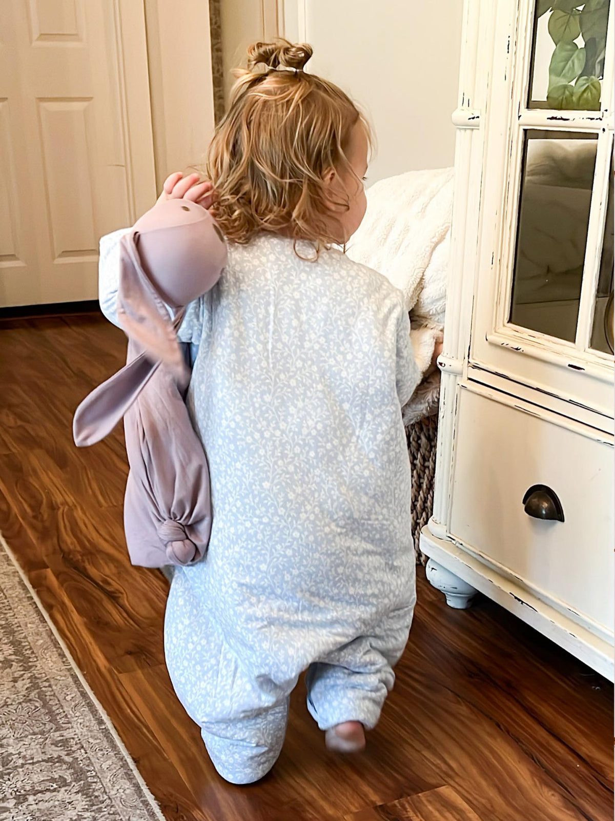Long sleeve footie sleep sack with light blue allover print, covered feet