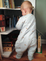Light gray footie sleep sack with moose print, long sleeves, zipper front, back view