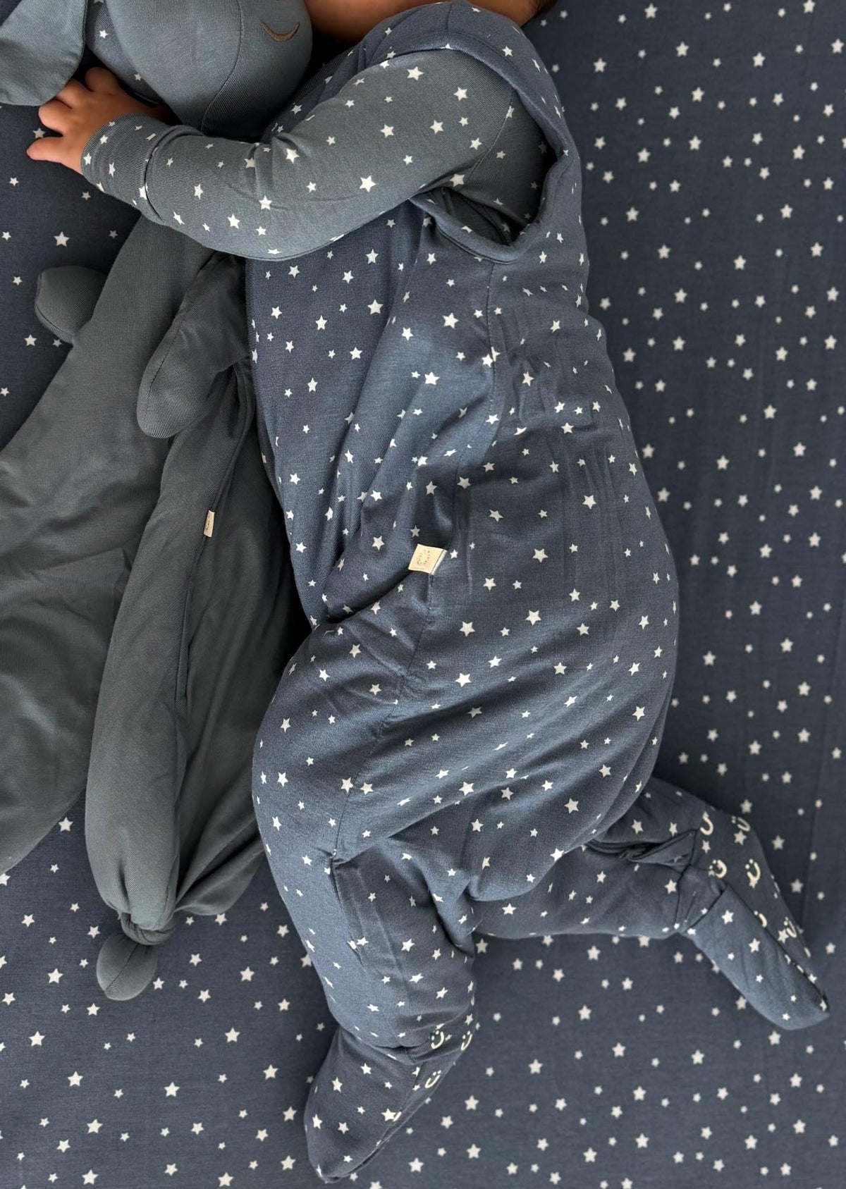 Dark gray star-pattern hooded footie sleep sack with front zipper and mittens