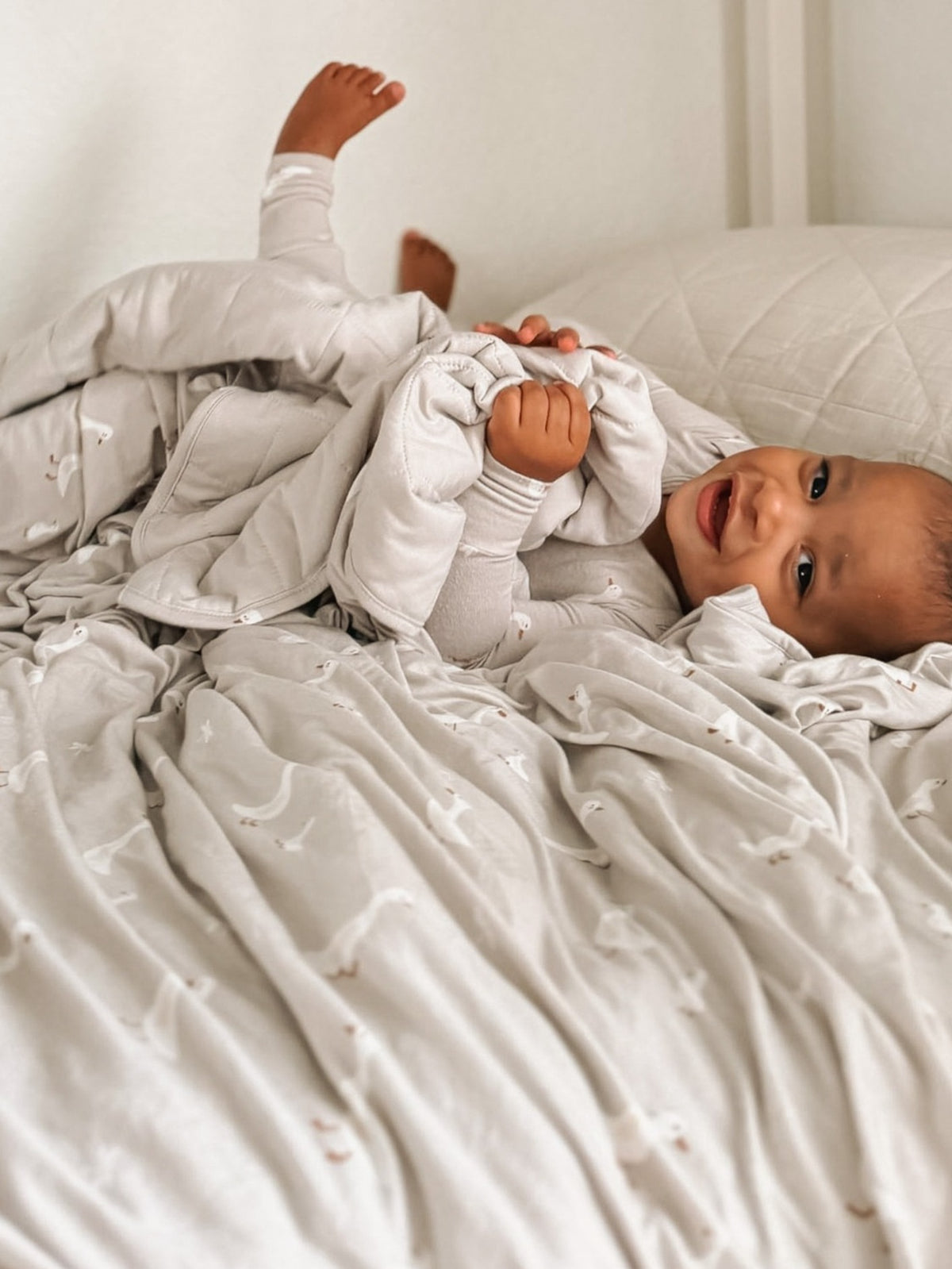 Light gray quilted twin blanket with soft stitched pattern
