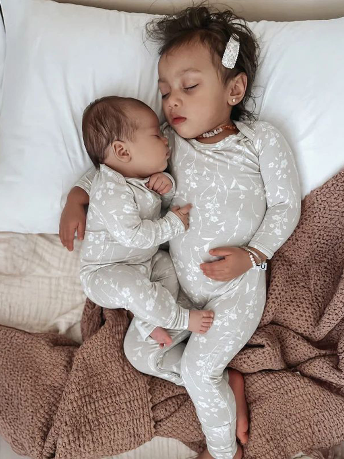 Light convertible pajama set with white floral print, long sleeves, and matching legs